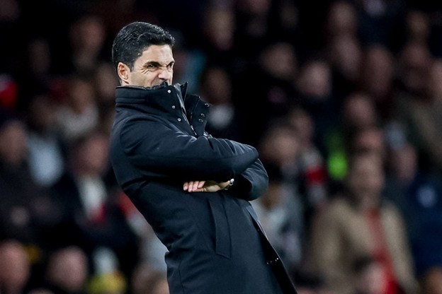 Arsenal manager Mikel Arteta reacts emotionally on the touchline during a UEFA Champions League match.