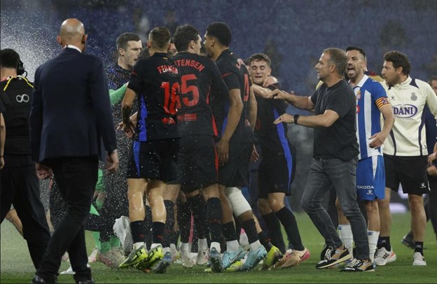 Tensions flare as Barcelona players and Espanyol staff clash on the pitch amid water spraying from sprinklers