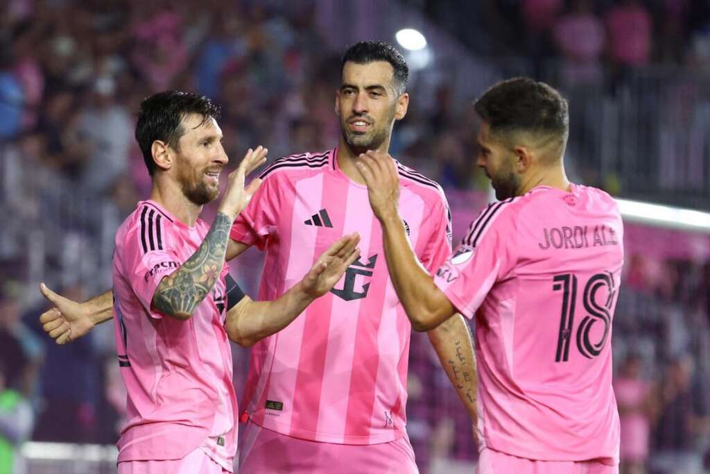 UFOOTBALL Sergio Busquets and Messi with Alba