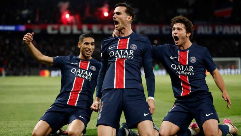 Paris Saint-Germain stars cheer after scoring in Champions League clash.