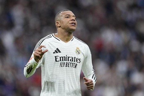 Mbappé acknowledges the crowd after scoring for Real Madrid.