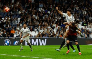Jesús Vallejo rises above a Mallorca defender to deliver a powerful header.