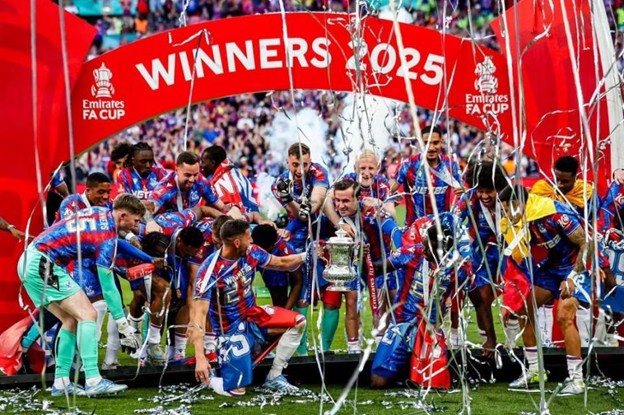 Crystal Palace players celebrate with the FA Cup trophy.